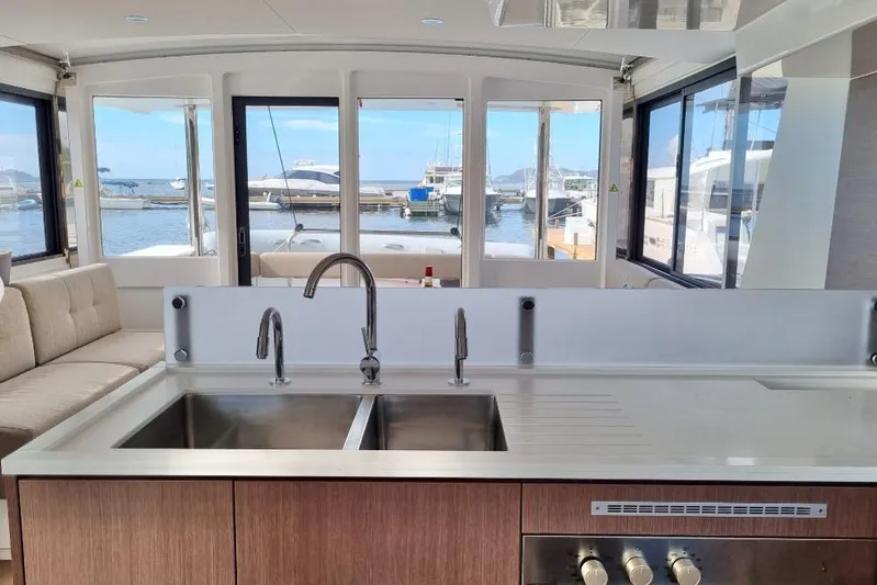 Breezin Yacht Photos Pics Interior of 2022 Bali 4.6 yacht with modern kitchen and marina view.
