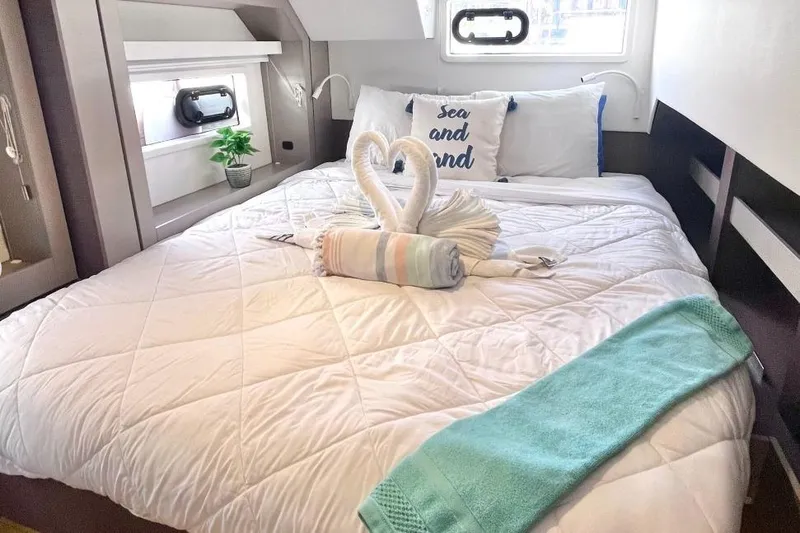 Breezin Yacht Photos Pics Luxurious Bali 4.6 yacht bedroom with elegant swan towel art, 2022 model.