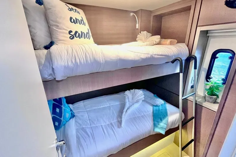 Breezin Yacht Photos Pics Bali 4.6 yacht 2022 interior with cozy bunk beds and nautical decor.