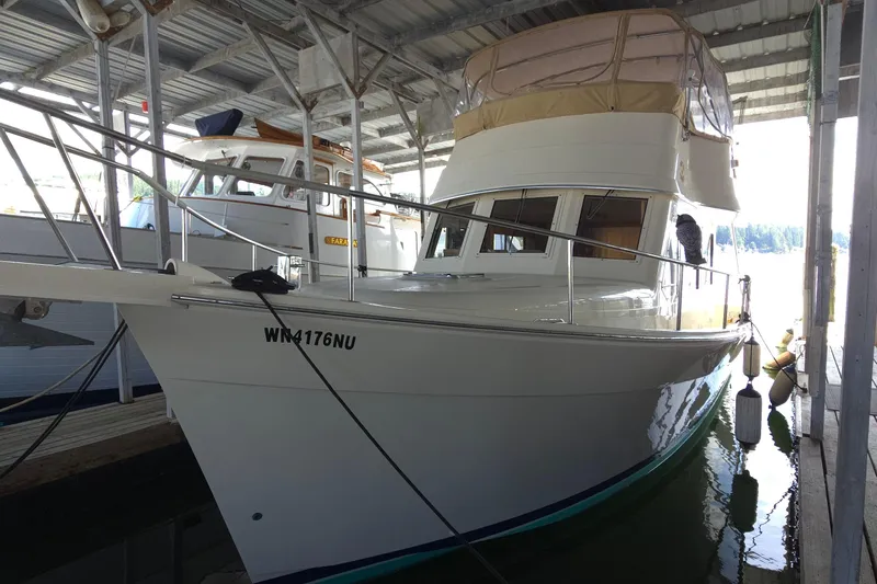 Nite Owl Yacht Photos Pics docked in a covered marina