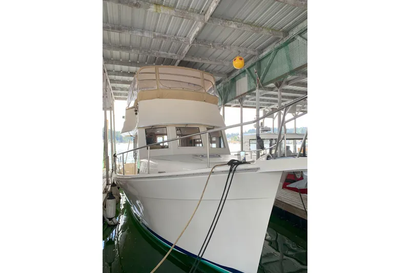 Nite Owl Yacht Photos Pics 2007 Mainship 34 Trawler docked under a covered marina