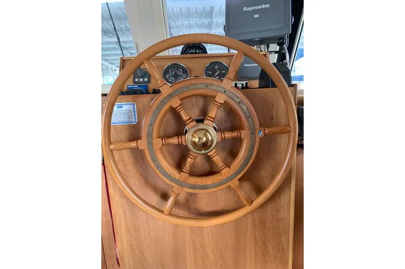 Nite Owl Yacht Photos Pics wooden helm with navigation instruments