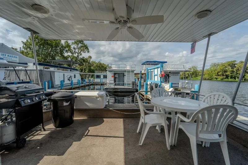 Southern Belle Yacht Photos Pics 2014 Sunstar Houseboats 55 with outdoor seating, grill, and marina view.