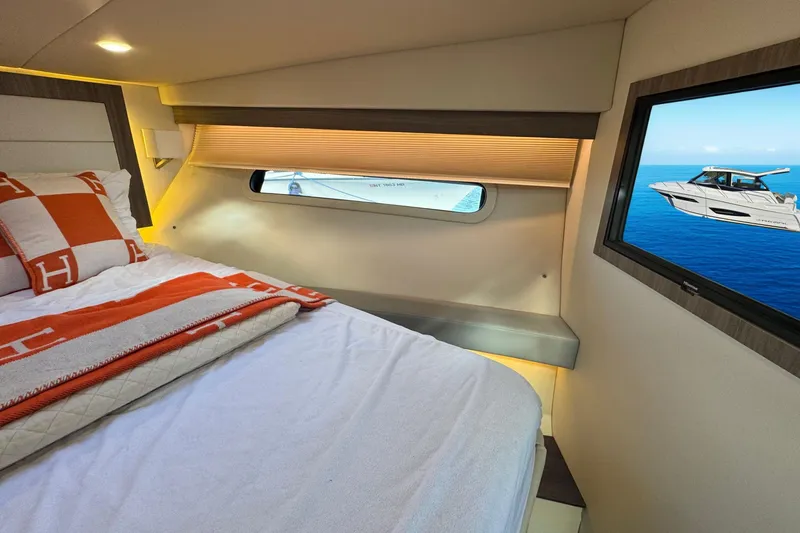  Yacht Photos Pics Luxurious cabin interior of 2021 Regal 38 Grande Coupe yacht with ocean view.