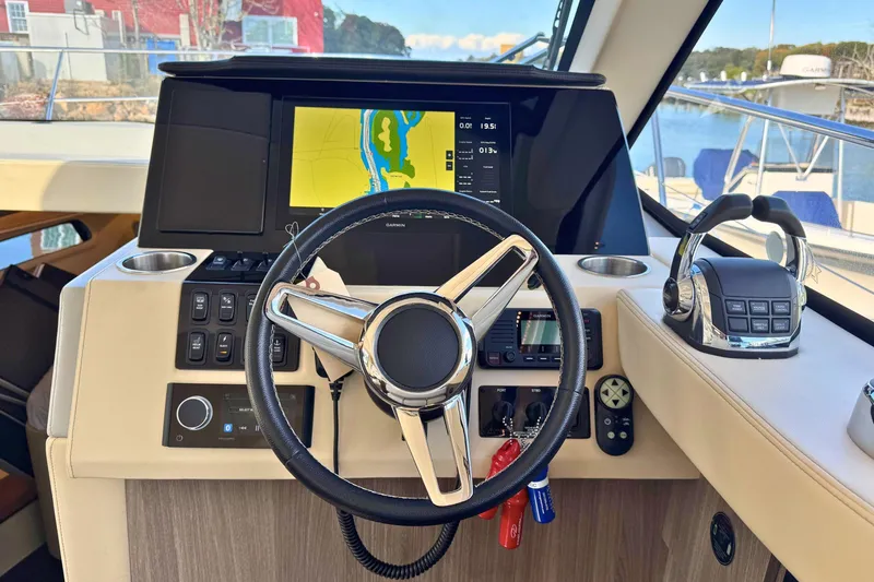  Yacht Photos Pics 2021 Regal 38 Grande Coupe helm with navigation display and controls.