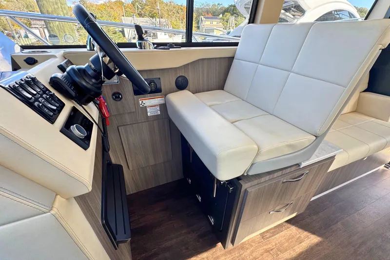  Yacht Photos Pics Interior of 2021 Regal 38 Grande Coupe with modern helm and seating area.