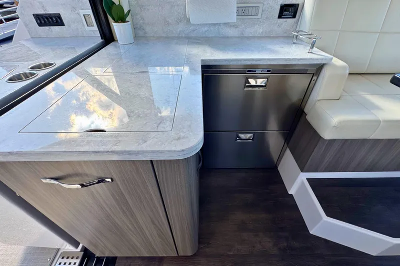  Yacht Photos Pics Modern kitchen area in 2021 Regal 38 Grande Coupe yacht with sleek countertops.