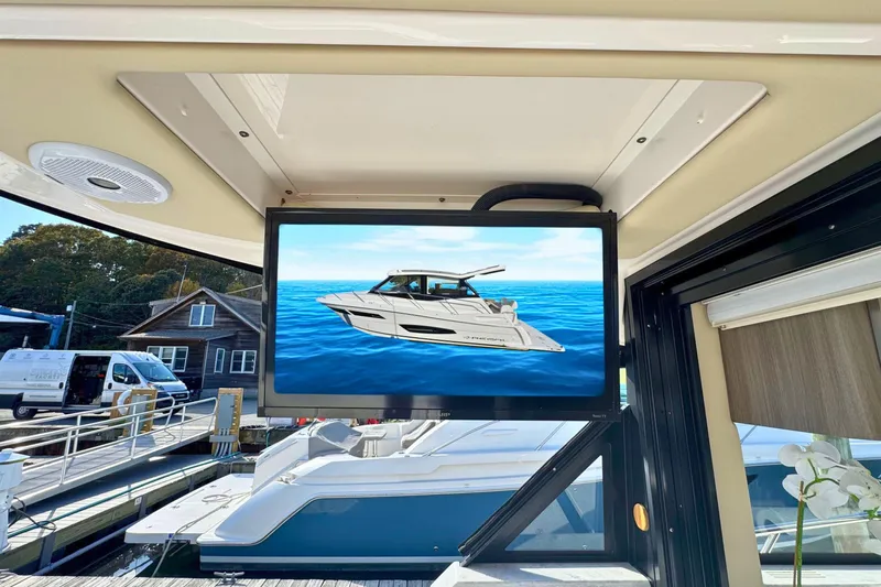  Yacht Photos Pics 2021 Regal 38 Grande Coupe displayed on screen inside a yacht.