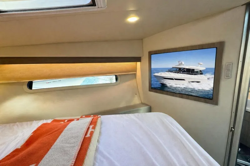  Yacht Photos Pics Interior of 2021 Regal 38 Grande Coupe with yacht image on wall.