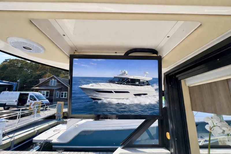  Yacht Photos Pics 2021 Regal 38 Grande Coupe yacht displayed on a screen at a marina.