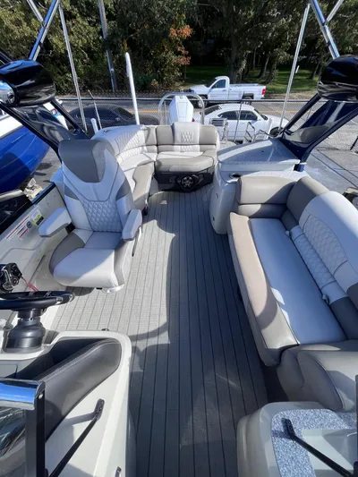  Yacht Photos Pics 2023 Avalon Excalibur Elite Windshield 27' boat interior with luxurious seating and modern design.