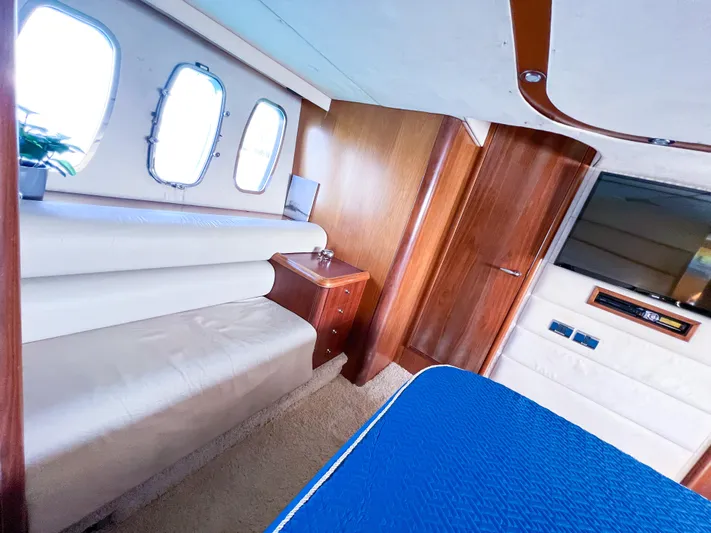  Yacht Photos Pics Luxurious interior of 2005 Sunseeker Predator 68 yacht with wood accents and plush seating.