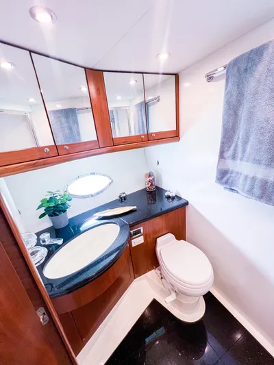  Yacht Photos Pics Luxurious bathroom in 2005 Sunseeker Predator 68 yacht with modern fixtures and elegant design.