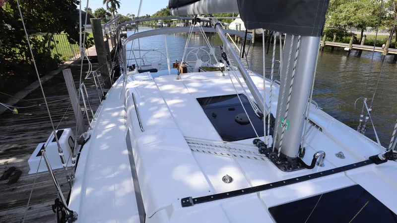 Wisp Yacht Photos Pics 2020 Hanse 388 yacht docked by a serene waterfront.