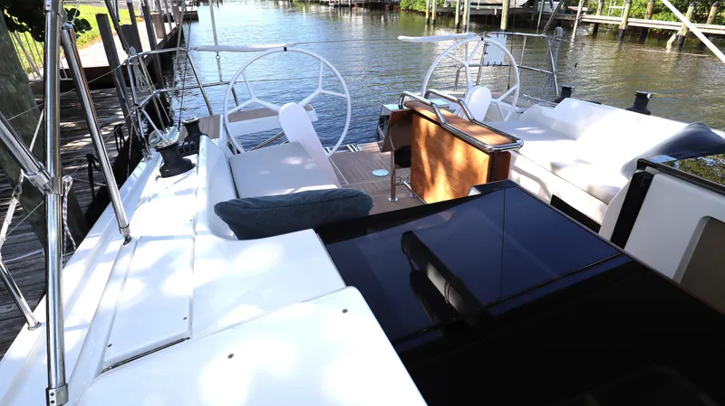 Wisp Yacht Photos Pics Hanse 388 sailboat cockpit, 2020 model, docked by a serene waterfront.
