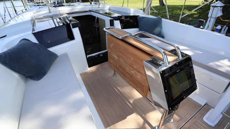 Wisp Yacht Photos Pics 2020 Hanse 388 yacht cockpit with seating, table, and navigation equipment.