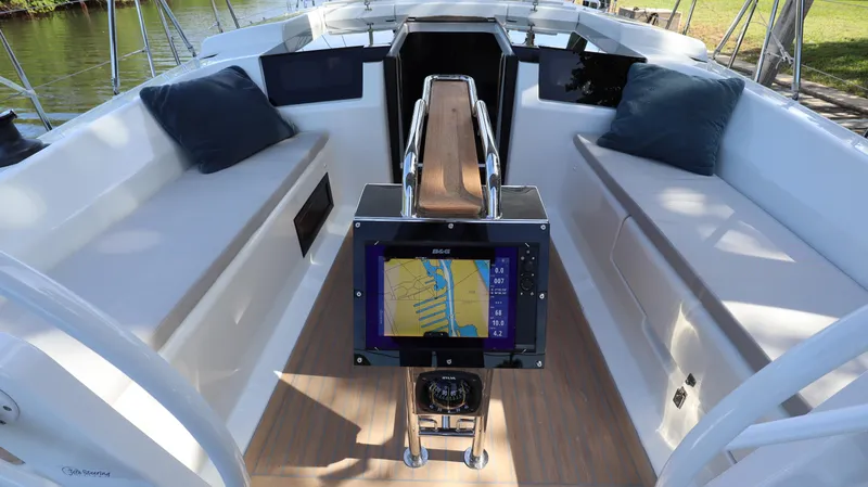 Wisp Yacht Photos Pics Cockpit of 2020 Hanse 388 sailboat with navigation system and cushioned seating.