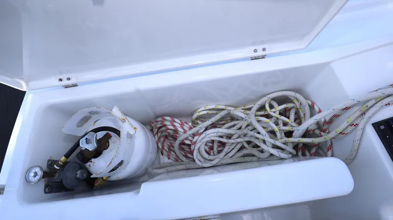 Wisp Yacht Photos Pics Open storage compartment on 2020 Hanse 388 yacht with ropes and gas cylinder.