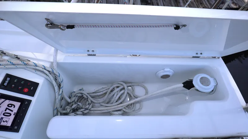 Wisp Yacht Photos Pics Open storage compartment on 2020 Hanse 388 yacht with ropes and equipment.