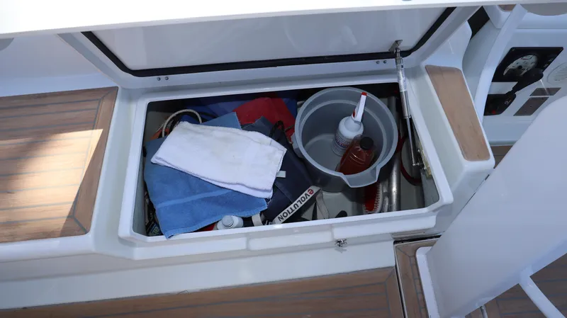Wisp Yacht Photos Pics Storage compartment on 2020 Hanse 388 yacht with cleaning supplies and towels.