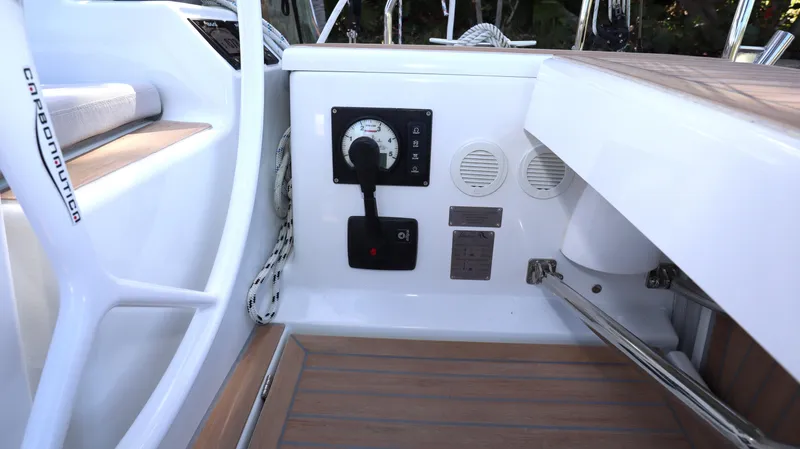 Wisp Yacht Photos Pics 2020 Hanse 388 yacht cockpit with control panel and wooden flooring.