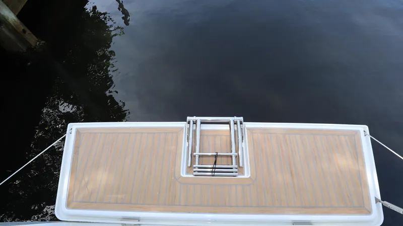 Wisp Yacht Photos Pics Stern view of 2020 Hanse 388 yacht with wooden deck and ladder.