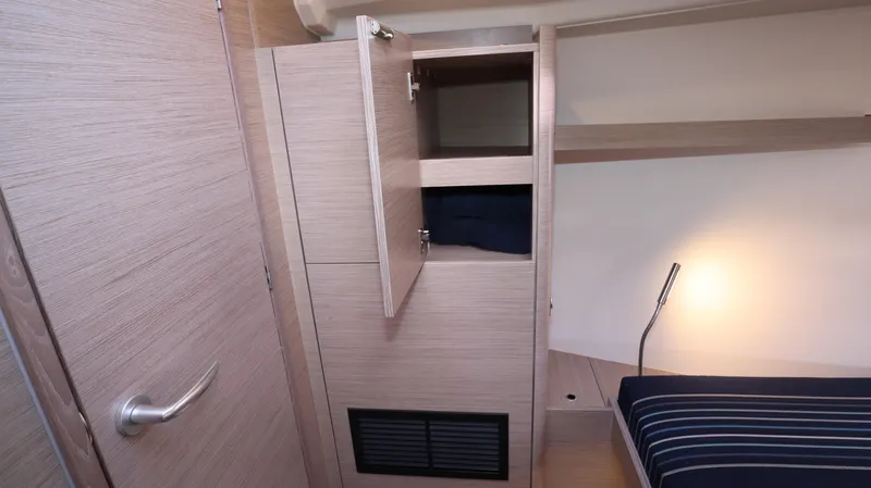 Wisp Yacht Photos Pics Interior of 2020 Hanse 388 yacht cabin with open closet and bed.