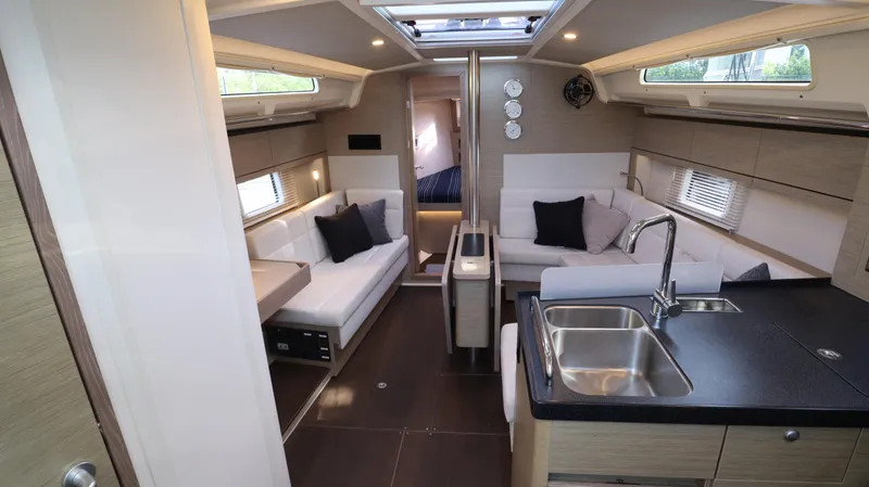 Wisp Yacht Photos Pics Luxurious interior of 2020 Hanse 388 yacht with modern kitchen and seating area.