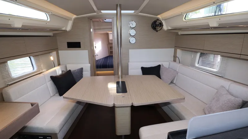 Wisp Yacht Photos Pics Interior of 2020 Hanse 388 yacht with modern seating and dining area.