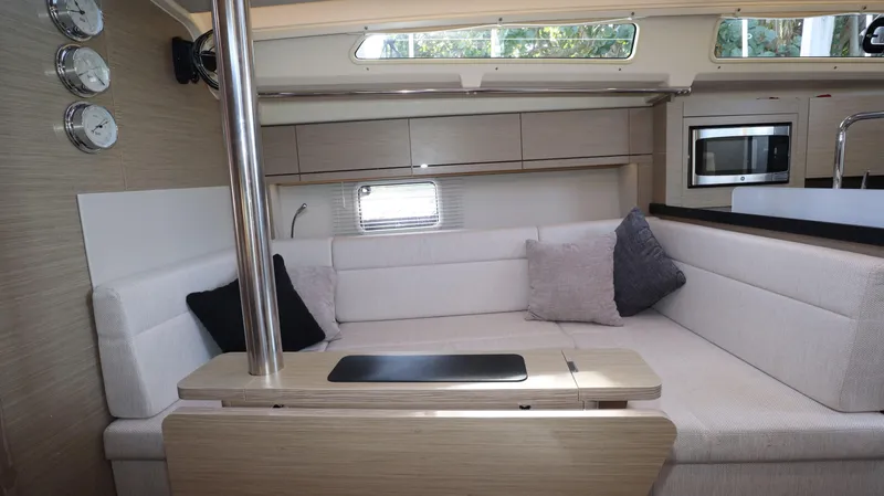 Wisp Yacht Photos Pics Interior of 2020 Hanse 388 yacht with modern seating and kitchen area.