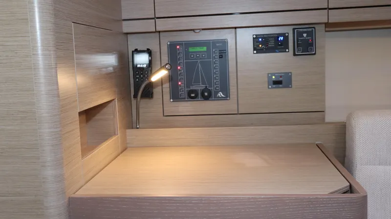 Wisp Yacht Photos Pics Control panel and desk area inside a 2020 Hanse 388 yacht cabin.