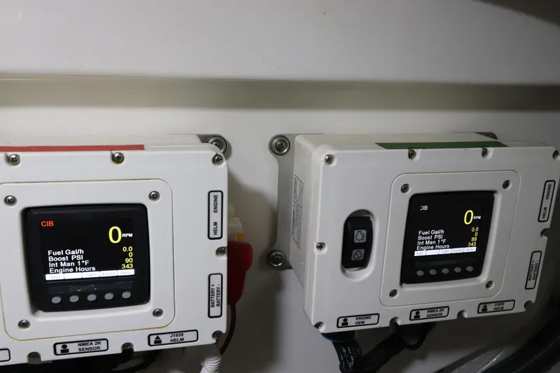 Lady K Yacht Photos Pics Engine control panels on a 2020 Tiara Yachts 43 Open, displaying fuel and engine data.