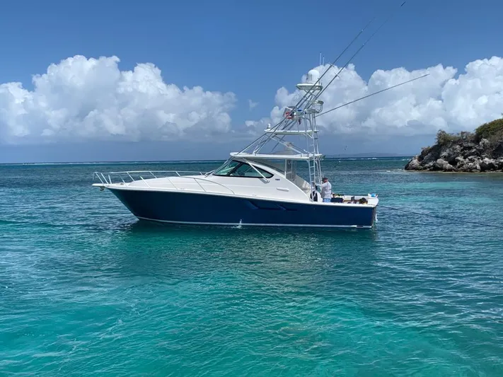 Lady K Yacht Photos Pics 2020 Tiara Yachts 43 Open in clear turquoise waters under a blue sky.