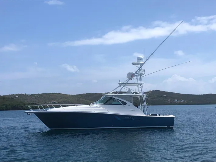 Lady K Yacht Photos Pics 2020 Tiara Yachts 43 Open in calm waters, side view with clear sky.