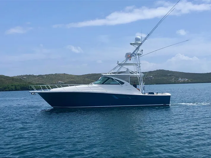 Lady K Yacht Photos Pics 2020 Tiara Yachts 43 Open cruising on calm waters under a clear sky.