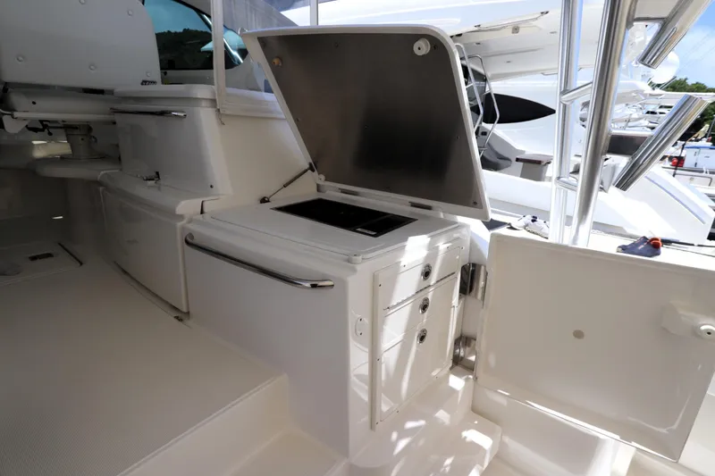 Lady K Yacht Photos Pics 2020 Tiara Yachts 43 Open interior with open storage compartments and sleek design.