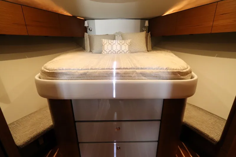 Lady K Yacht Photos Pics Luxurious cabin interior of 2020 Tiara Yachts 43 Open with elegant bedding and wood accents.