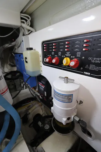 Lady K Yacht Photos Pics Engine room of 2020 Tiara Yachts 43 Open, featuring control panel and fuel-water separator.