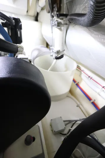 Lady K Yacht Photos Pics Engine room of 2020 Tiara Yachts 43 Open, showcasing mechanical components and piping.