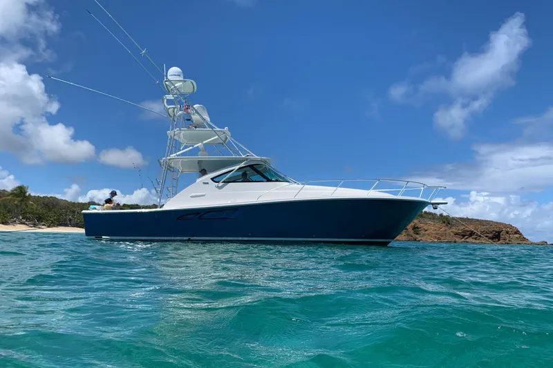 Lady K Yacht Photos Pics 2020 Tiara Yachts 43 Open cruising in clear blue waters under a sunny sky.