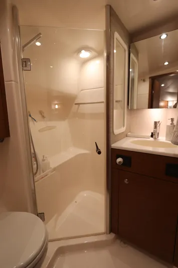 Lady K Yacht Photos Pics Luxurious bathroom in 2020 Tiara Yachts 43 Open, featuring modern shower and vanity.
