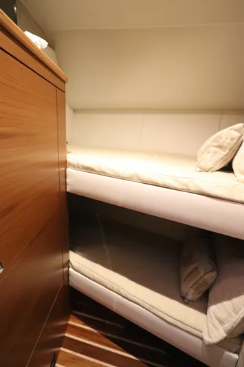Lady K Yacht Photos Pics 2020 Tiara Yachts 43 Open cabin with cozy bunk beds and wooden cabinetry.