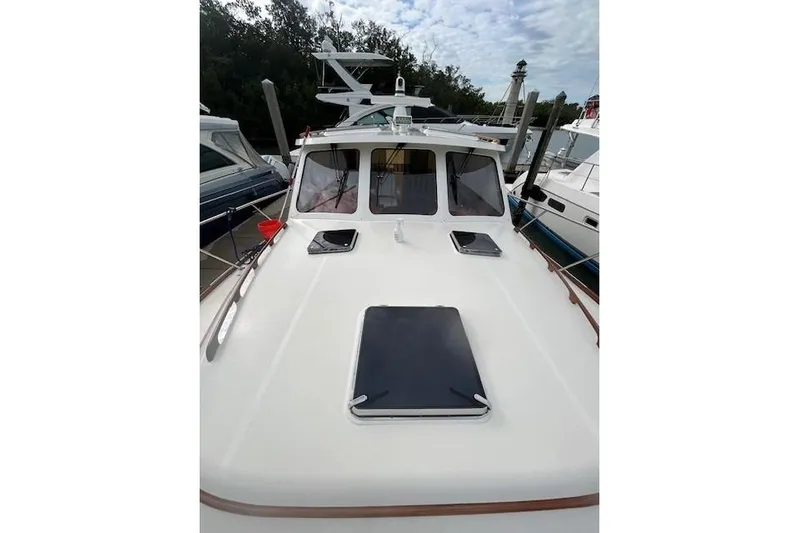 Aquarius Yacht Photos Pics 2024 Hinckley Talaria 43 MY yacht docked, showcasing sleek deck design and modern features.