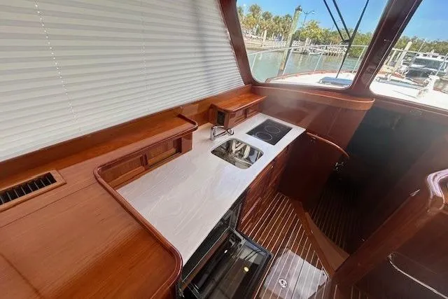 Aquarius Yacht Photos Pics Luxurious 2024 Hinckley Talaria 43 MY yacht interior with sleek kitchen design.