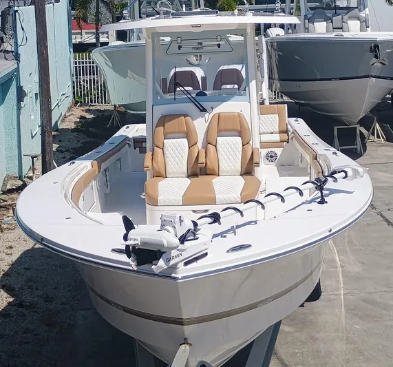  Yacht Photos Pics 2025 Regulator 30XO boat with tan seating, docked outdoors.