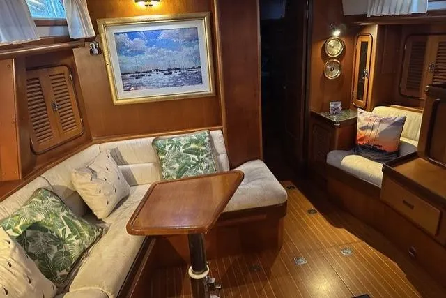 Wild Spirit Yacht Photos Pics Cozy 1999 Passport 456 yacht interior with wood paneling and plush seating.