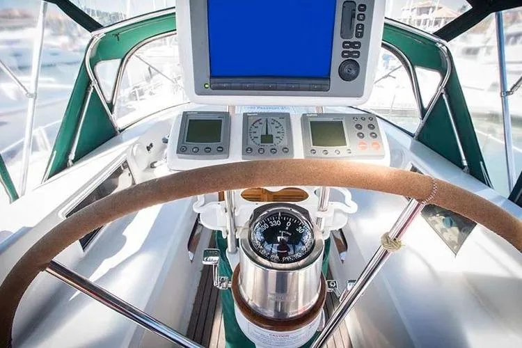 Wild Spirit Yacht Photos Pics Cockpit of a 1999 Passport 456 sailboat with navigation instruments and compass.
