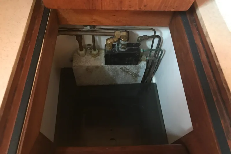 Wild Spirit Yacht Photos Pics Hidden compartment with plumbing and valves in a Passport 456, 1999 model.