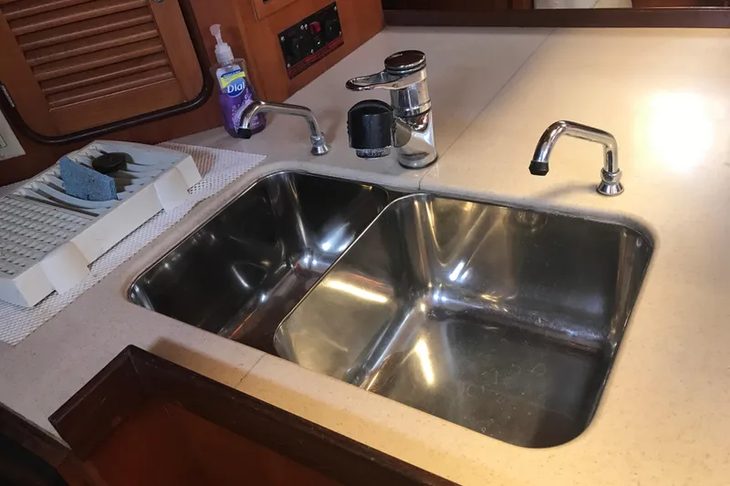 Wild Spirit Yacht Photos Pics Stainless steel double sink in a Passport 456 yacht kitchen, 1999 model.