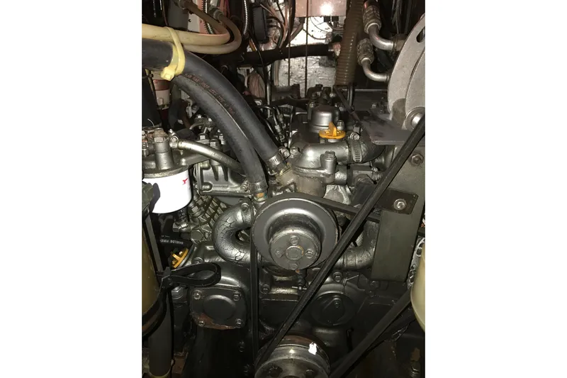 Wild Spirit Yacht Photos Pics Engine of a 1999 Passport 456 model with visible belts and hoses.